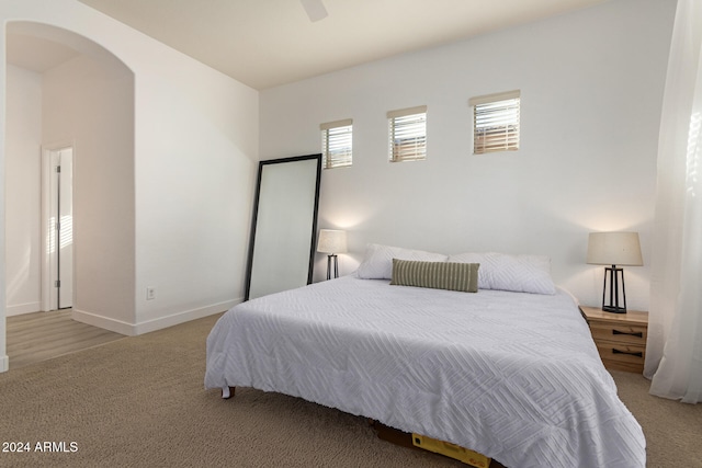 carpeted bedroom featuring ceiling fan