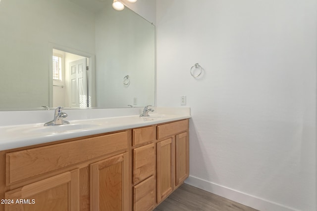 bathroom with vanity and hardwood / wood-style flooring