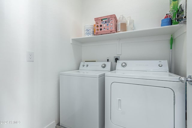 laundry room featuring separate washer and dryer