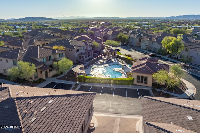 birds eye view of property with a mountain view