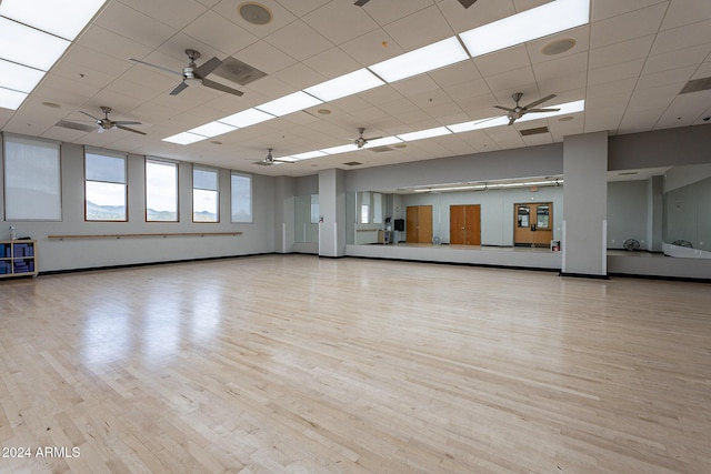 unfurnished room featuring a paneled ceiling and light hardwood / wood-style flooring