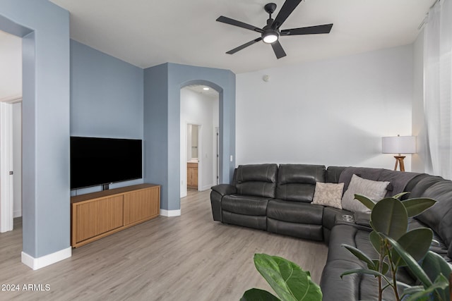 living room featuring ceiling fan and light hardwood / wood-style floors