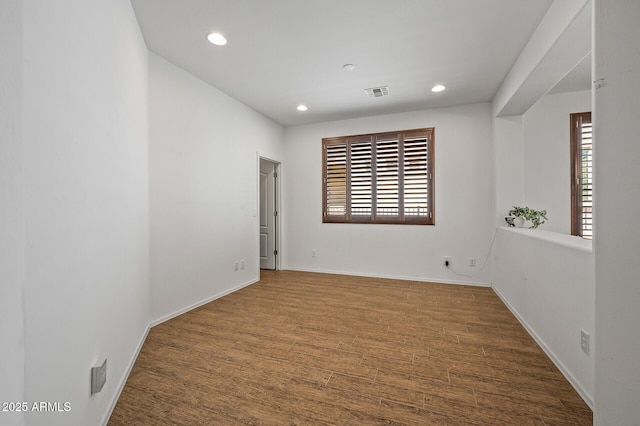 301 S 225th Ave, Buckeye, AZ 85326 - empty room with visible vents, baseboards, recessed lighting, and wood finished floors