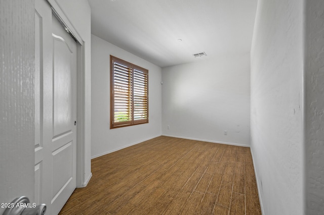 301 S 225th Ave, Buckeye, AZ 85326 - unfurnished room featuring visible vents, baseboards, and wood finished floors