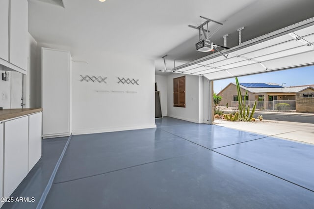 301 S 225th Ave, Buckeye, AZ 85326 - garage with a garage door opener and baseboards