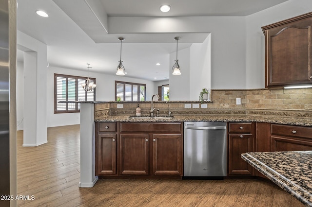 301 S 225th Ave, Buckeye, AZ 85326 - kitchen with dark wood finished floors, dishwasher, a sink, and dark stone countertops