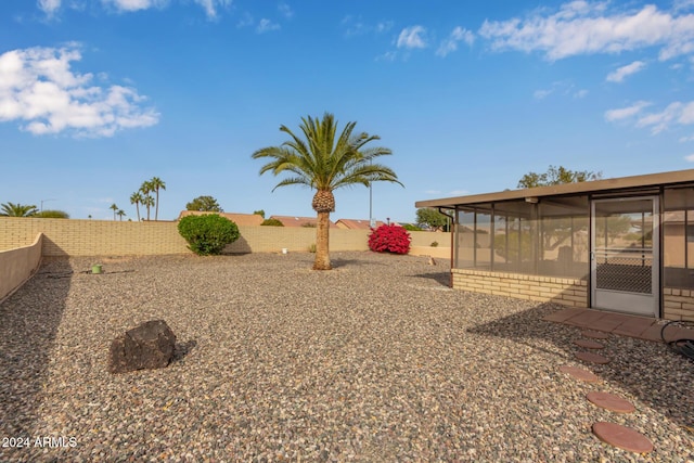 view of yard featuring a sunroom