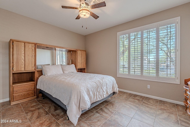 5077 E Lonesome Trl, Cave Creek, AZ 85331 - bedroom featuring baseboards and a ceiling fan