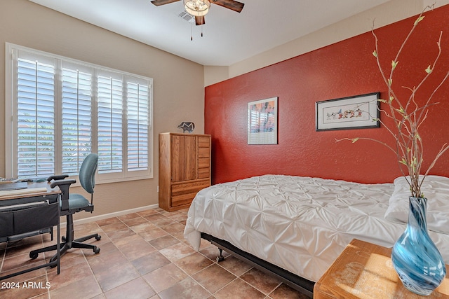 5077 E Lonesome Trl, Cave Creek, AZ 85331 - bedroom with baseboards, an office area, a textured wall, and ceiling fan