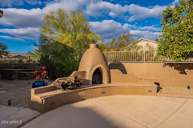 5077 E Lonesome Trl, Cave Creek, AZ 85331 - view of patio / terrace with exterior fireplace