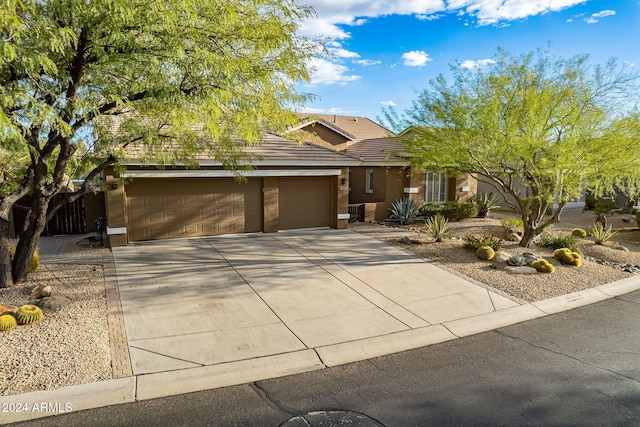 5077 E Lonesome Trl, Cave Creek, AZ 85331 - view of front of property with a tiled roof, concrete driveway, a garage, and stucco siding