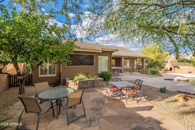 5077 E Lonesome Trl, Cave Creek, AZ 85331 - back of house with outdoor dining space, stucco siding, a tile roof, and a patio