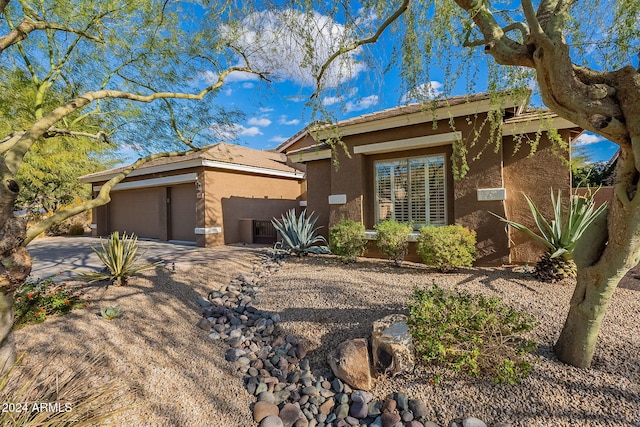 5077 E Lonesome Trl, Cave Creek, AZ 85331 - ranch-style house with stucco siding, a garage, concrete driveway, and a tiled roof