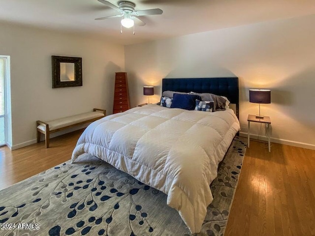 bedroom featuring light wood-type flooring and ceiling fan