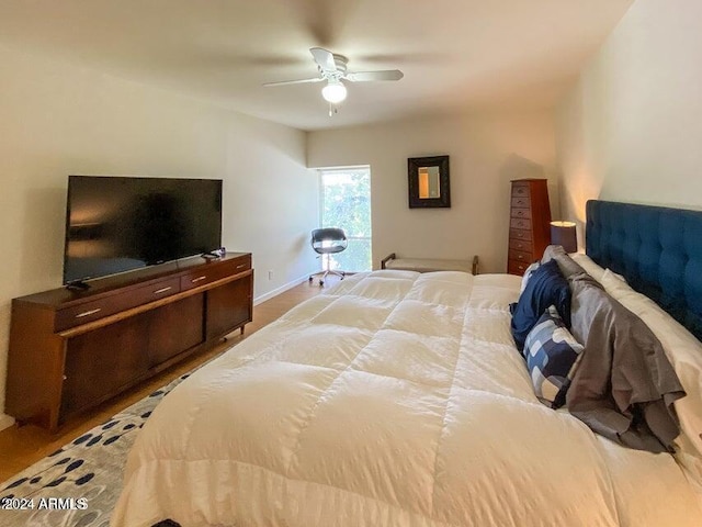 bedroom featuring ceiling fan and light hardwood / wood-style floors