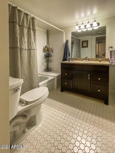 full bathroom with toilet, vanity, and shower / bathtub combination with curtain