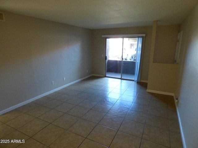 tiled empty room with baseboards