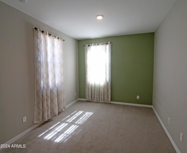 spare room featuring carpet floors