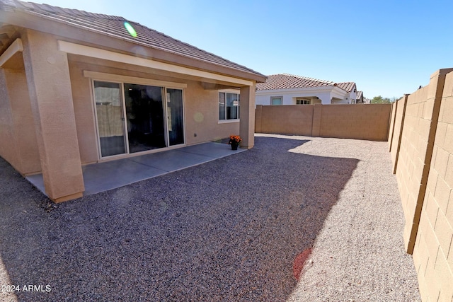 rear view of property featuring a patio area