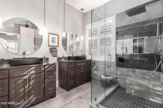 bathroom with an enclosed shower and vanity