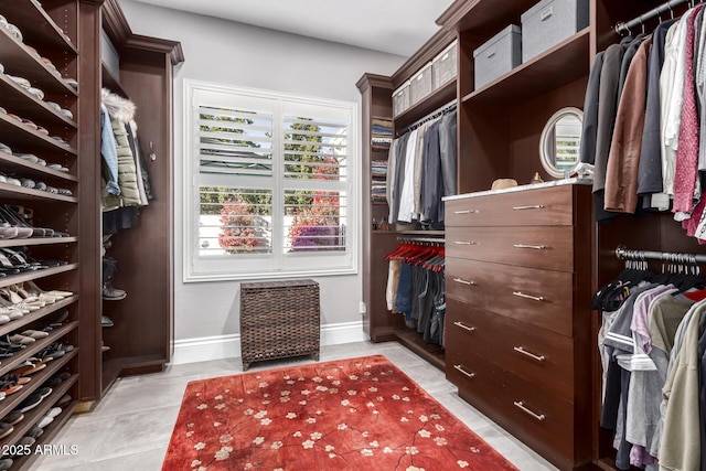 walk in closet featuring light tile patterned floors