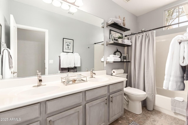 full bathroom with toilet, vanity, and shower / tub combo