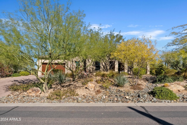 view of property hidden behind natural elements