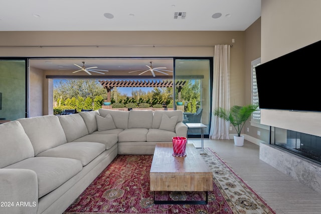 living room featuring carpet floors and a healthy amount of sunlight