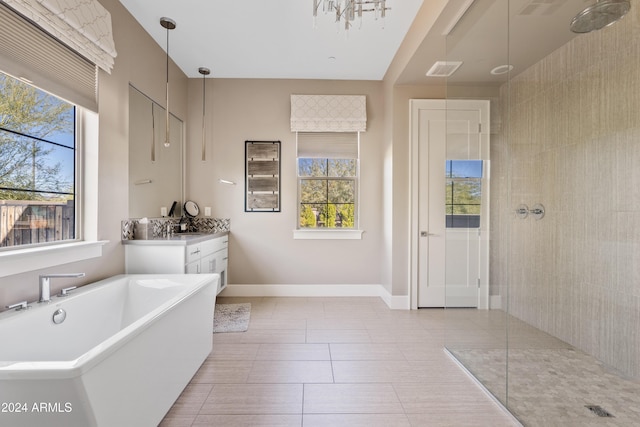 bathroom featuring separate shower and tub, tile patterned flooring, and vanity