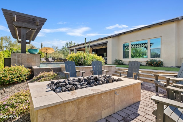 view of patio / terrace with an outdoor fire pit