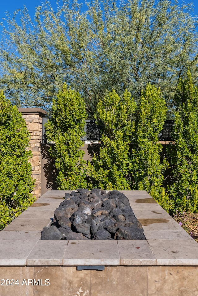 exterior details with an outdoor fire pit