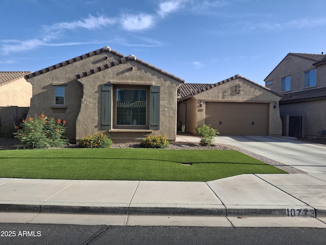 10773 W Prickly Pear Trl, Peoria, AZ 85383 - view of front of house featuring driveway, an attached garage, a tiled roof, stucco siding, and a front yard