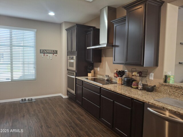 10773 W Prickly Pear Trl, Peoria, AZ 85383 - kitchen with wall chimney range hood, stainless steel appliances, dark wood-style floors, plenty of natural light, and recessed lighting