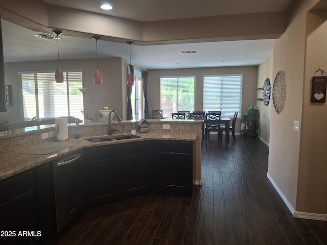 10773 W Prickly Pear Trl, Peoria, AZ 85383 - kitchen with dark wood-style floors, light stone counters, decorative light fixtures, and recessed lighting