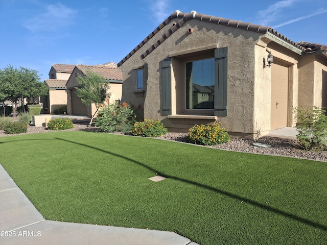 10773 W Prickly Pear Trl, Peoria, AZ 85383 - view of front of property with a tile roof, stucco siding, an attached garage, and a front lawn
