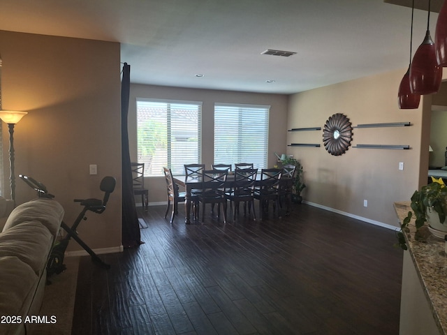 10773 W Prickly Pear Trl, Peoria, AZ 85383 - dining room with baseboards and dark wood-type flooring