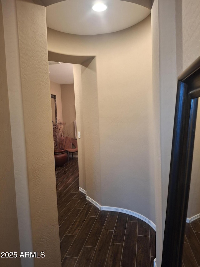 10773 W Prickly Pear Trl, Peoria, AZ 85383 - hallway with dark wood-type flooring and baseboards