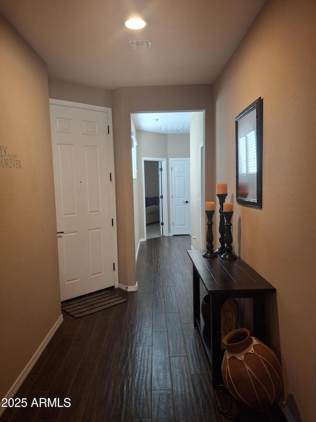 10773 W Prickly Pear Trl, Peoria, AZ 85383 - corridor with dark wood-type flooring and baseboards