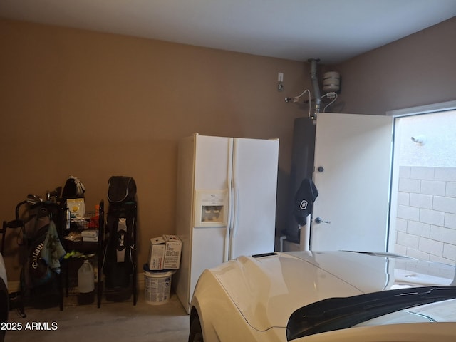 10773 W Prickly Pear Trl, Peoria, AZ 85383 - garage featuring white refrigerator with ice dispenser