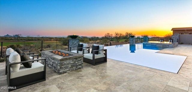 view of patio featuring an outdoor fire pit