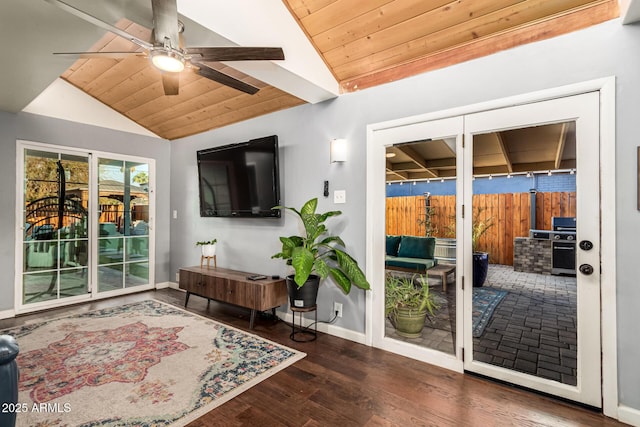 doorway to outside with lofted ceiling, wooden ceiling, ceiling fan, and wood finished floors