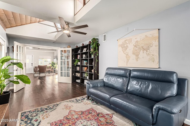 living area with ceiling fan, wood finished floors, visible vents, vaulted ceiling, and french doors