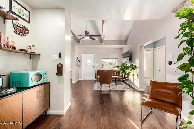 entryway featuring lofted ceiling with beams, baseboards, dark wood finished floors, and a ceiling fan