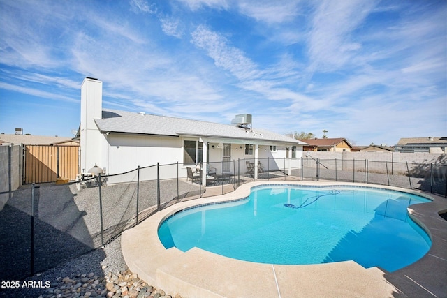 view of pool featuring a patio, a fenced backyard, and a fenced in pool