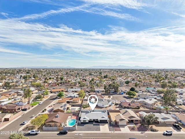 drone / aerial view featuring a mountain view and a residential view