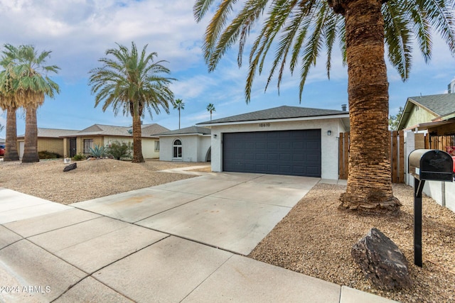 ranch-style home with a garage