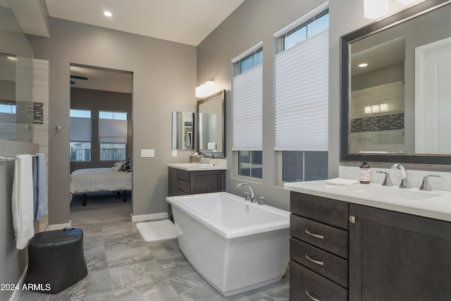 bathroom featuring a bath and vanity