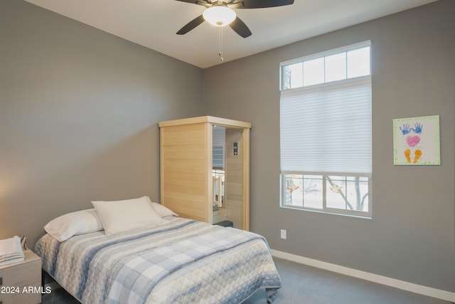 bedroom featuring ceiling fan and carpet flooring