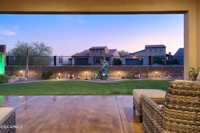 patio terrace at dusk with a lawn