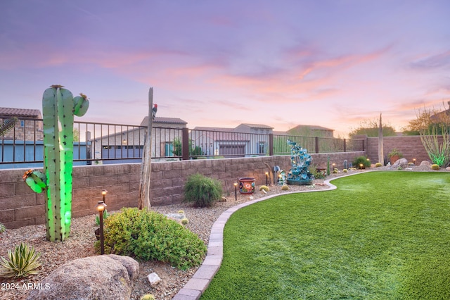 view of yard at dusk